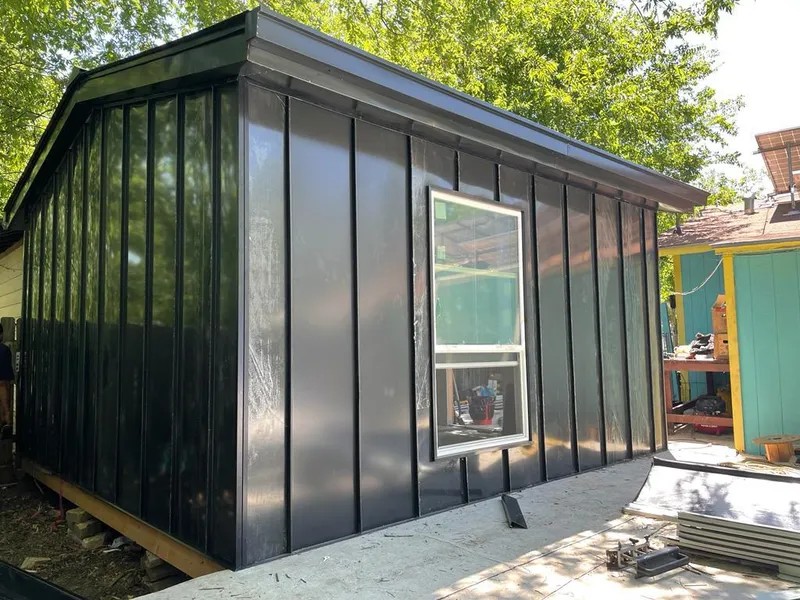 Black standing seam metal wall panels for Roof Inspection in Waxhaw